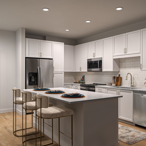 a kitchen with white cabinets