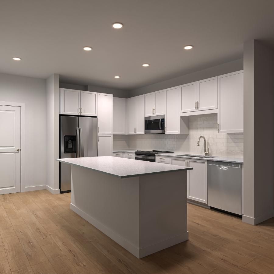 a kitchen with white cabinets