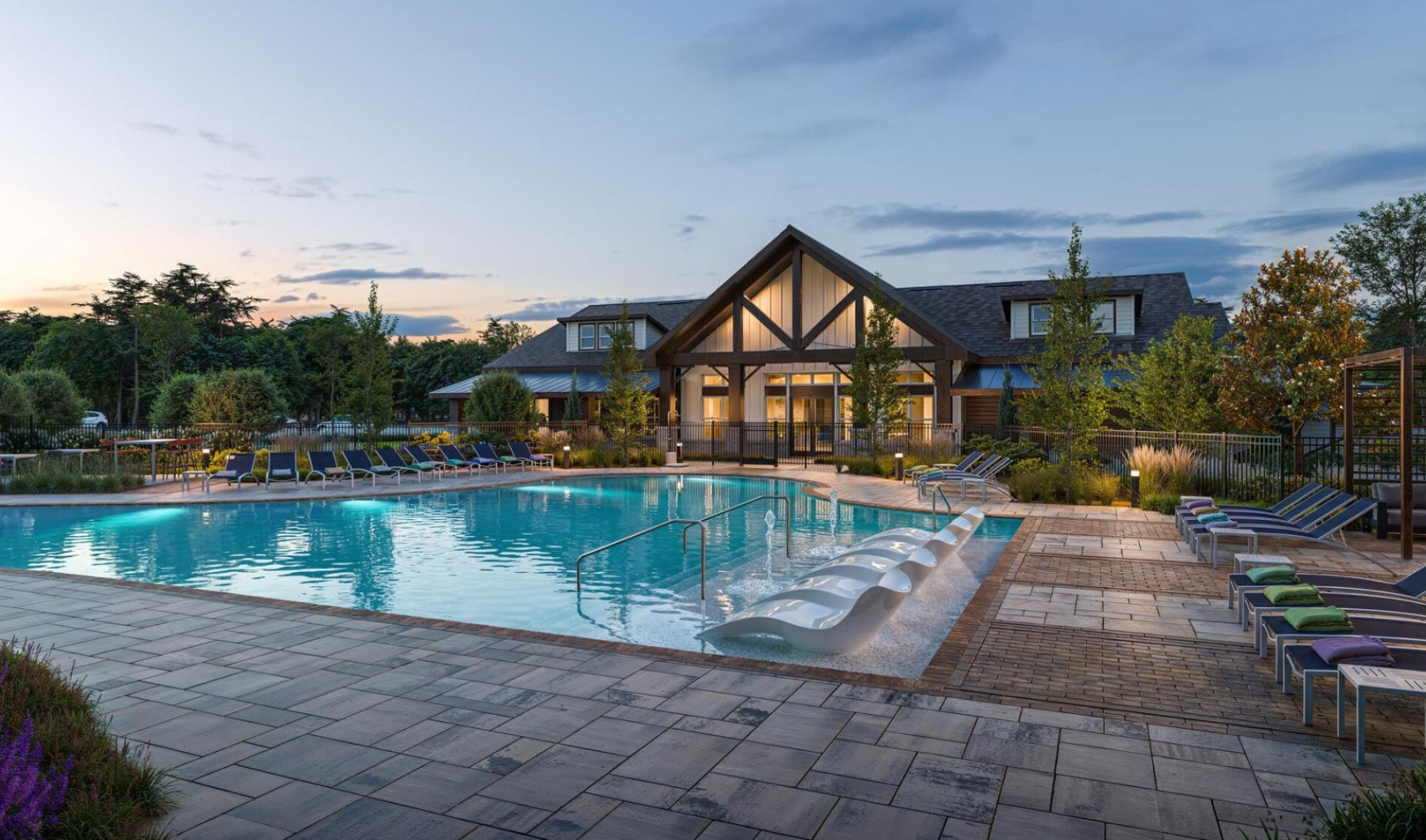 a swimming pool in front of a house